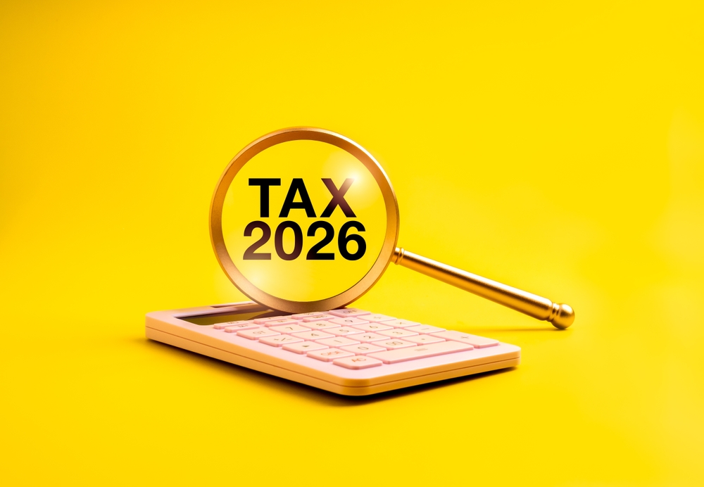 Tax,2026, Concept,With,Magnifying,Glass,Focusing,On,Text,Over