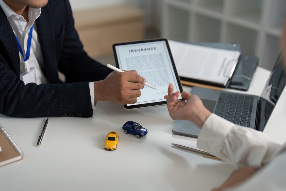 Excellium insurance technology consultant in Lagos using tablet