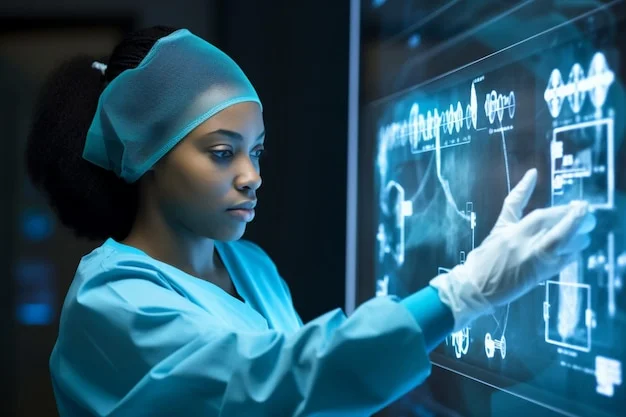Female surgeon on scrub clothes while operating monitor